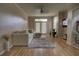 Bright and airy living room featuring hardwood floors, a comfy couch and neutral paint to create a relaxing atmosphere at 6300 Raleigh St # 102, Orlando, FL 32835