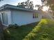 This home has a big backyard with bright green grass and a white home at 730 Barber Cir, Lakeland, FL 33803