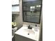 Bathroom featuring a vanity with a white sink, bronze faucet, and walk-in shower with glass door at 730 Barber Cir, Lakeland, FL 33803
