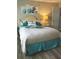 A comfortably furnished bedroom with soothing decor and natural light from the side table lamp at 730 Barber Cir, Lakeland, FL 33803