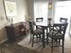 Dining area with a dark wood table and a carpet with a light design at 730 Barber Cir, Lakeland, FL 33803