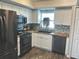 Updated kitchen featuring new appliances, butcher block countertops and tile backsplash at 730 Barber Cir, Lakeland, FL 33803