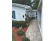 Landscaping featuring flowers and greenery leading up to the house at 730 Barber Cir, Lakeland, FL 33803