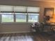 Office area with a desk, computer, and natural light from three windows at 730 Barber Cir, Lakeland, FL 33803