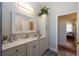 Bathroom featuring a modern vanity with marble countertops, a large mirror, and built in storage at 14365 Evans Ranch Rd, Lakeland, FL 33809