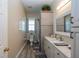 Bathroom featuring a modern vanity with marble countertops, tiled shower, and neutral decor at 14365 Evans Ranch Rd, Lakeland, FL 33809