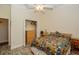 Bedroom featuring wood look floors, a ceiling fan, and closet at 14365 Evans Ranch Rd, Lakeland, FL 33809