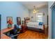 Bedroom featuring hardwood floors, a ceiling fan and a comfortable space to relax at 14365 Evans Ranch Rd, Lakeland, FL 33809