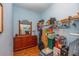 Walk in closet with a built in shelving and loaded with boxes and totes at 14365 Evans Ranch Rd, Lakeland, FL 33809