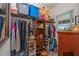 Organized walk-in closet with ample storage space, shelving, and hanging rods for clothes and accessories at 14365 Evans Ranch Rd, Lakeland, FL 33809