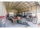 Spacious garage with high ceilings, housing a trailer and camper, perfect for storage and hobbies at 14365 Evans Ranch Rd, Lakeland, FL 33809