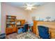 Comfortable home office with ceiling fan, carpet, and beautiful natural wood furniture at 14365 Evans Ranch Rd, Lakeland, FL 33809