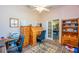 Cozy home office with light pink walls, ceiling fan, and two desks at 14365 Evans Ranch Rd, Lakeland, FL 33809