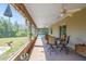 Inviting outdoor patio with a ceiling fan and comfortable seating, perfect for relaxing outdoors at 14365 Evans Ranch Rd, Lakeland, FL 33809