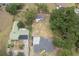 This aerial view showcases the home nestled among mature trees on a large lot at 1816 W Lake Parker Dr, Lakeland, FL 33805