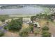 A lakefront property features mature trees, a large lawn, and a serene setting at 1816 W Lake Parker Dr, Lakeland, FL 33805