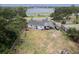 A spacious backyard features a large lawn near a lake, perfect for outdoor activities and relaxation at 1816 W Lake Parker Dr, Lakeland, FL 33805