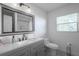 Well-lit bathroom featuring modern vanity, fixtures, and ample storage at 1816 W Lake Parker Dr, Lakeland, FL 33805