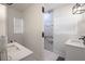 Modern bathroom featuring a marble shower, double sink vanity, and stylish fixtures at 1816 W Lake Parker Dr, Lakeland, FL 33805