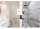 Bright bathroom with modern shower, toilet, vanity, and sleek fixtures at 1816 W Lake Parker Dr, Lakeland, FL 33805