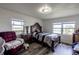 Inviting bedroom with water view, traditional decor, and comfortable seating area at 1816 W Lake Parker Dr, Lakeland, FL 33805