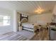 Bright and airy bedroom with beadboard ceiling, neutral tones, and modern fixtures at 1816 W Lake Parker Dr, Lakeland, FL 33805