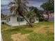 Side view of a single-story home with a well-maintained lawn at 1816 W Lake Parker Dr, Lakeland, FL 33805