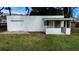 Detached garage with a covered porch, offering secure parking and additional storage space at 1816 W Lake Parker Dr, Lakeland, FL 33805