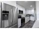 Bright, updated kitchen features stainless steel appliances, white cabinetry, and a modern farmhouse sink at 1816 W Lake Parker Dr, Lakeland, FL 33805