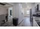 Modern kitchen with white cabinets, stainless steel appliances, and a dining area at 1816 W Lake Parker Dr, Lakeland, FL 33805