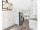 Well-lit kitchen with white cabinetry, stainless appliances, and updated countertops and flooring at 1816 W Lake Parker Dr, Lakeland, FL 33805