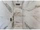Luxurious shower featuring elegant marble tiling, rainfall showerhead, and built-in niche at 1816 W Lake Parker Dr, Lakeland, FL 33805