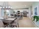 Modern kitchen featuring stainless steel appliances, a center island, and ample cabinetry at 2076 Babbling Brook Blvd, Auburndale, FL 33823
