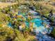 Aerial view showcasing a large community pool with a lazy river and palm trees at 7523 Excitement Dr, Kissimmee, FL 34747