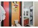 Toilet and vanity in a bathroom with Mickey Mouse wallpaper at 7523 Excitement Dr, Kissimmee, FL 34747