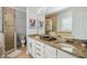 Bathroom with a double sink vanity and tile shower at 7523 Excitement Dr, Kissimmee, FL 34747
