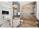 The bathroom features a stand up shower with glass doors, granite vanity, and access to the bedroom at 7523 Excitement Dr, Kissimmee, FL 34747