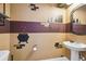 Themed bathroom has wizardry touches added in the wall decor at 7523 Excitement Dr, Kissimmee, FL 34747