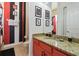 Bathroom vanity with a neutral toned granite countertop at 7523 Excitement Dr, Kissimmee, FL 34747