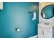 Updated bathroom with modern fixtures and bright blue accent wall at 7523 Excitement Dr, Kissimmee, FL 34747