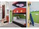 Fun bedroom featuring a bunk bed and bathroom access at 7523 Excitement Dr, Kissimmee, FL 34747