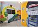 Fun-themed ' room with slide, climbing wall, and custom bunk beds at 7523 Excitement Dr, Kissimmee, FL 34747