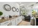 Kitchen area features granite counters, white cabinets and overlooks the dining area and backyard at 7523 Excitement Dr, Kissimmee, FL 34747
