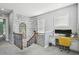 Landing with an accent wall, and a desk area perfect for study or work at 7523 Excitement Dr, Kissimmee, FL 34747