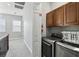Hallway with a laundry room including washer and dryer at 7523 Excitement Dr, Kissimmee, FL 34747