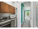 Functional laundry room with modern washer/dryer and built-in cabinets, creating a convenient space at 7523 Excitement Dr, Kissimmee, FL 34747