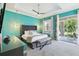 Spacious main bedroom with tray ceilings and a glass door at 7523 Excitement Dr, Kissimmee, FL 34747