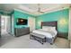 Main bedroom with a king bed and a view of a door at 7523 Excitement Dr, Kissimmee, FL 34747