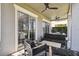 Outdoor patio with comfortable seating and ceiling fans at 7523 Excitement Dr, Kissimmee, FL 34747