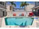 Backyard pool with lush landscaping and seating at 7523 Excitement Dr, Kissimmee, FL 34747